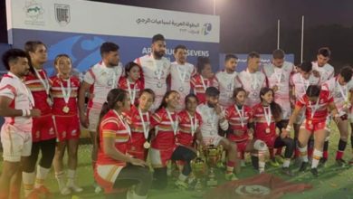 Tunisia male and female teams celebrating together.